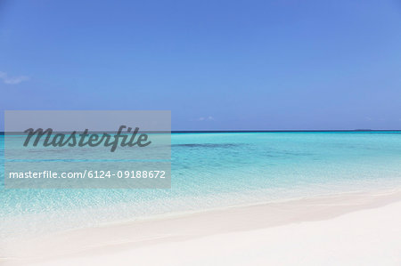 Tranquil, sunny blue ocean beach, Maldives, Indian Ocean Tranquil, sunny blue ocean beach, Maldives, Indian Ocean