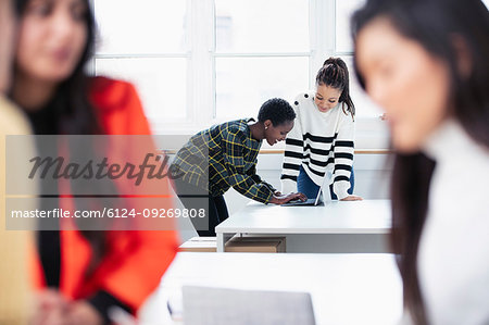 Businesswomen working in new office