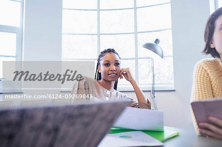 Attentive businesswoman listening in conference room meeting