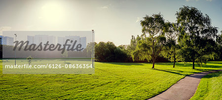 Sweden, Skane, Malmo, View of park, apartment buildings in background