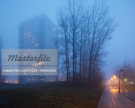Sweden, Skane, Malmo, Hogaholm, Almvik, Residential buildings in fog