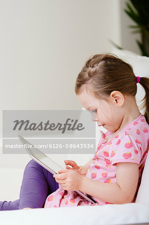 Sweden, Girl (2-3) using digital tablet