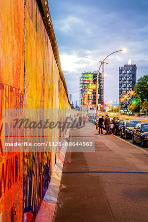 Germany, Berlin, East Side Gallery, View along Berlin Wall at dawn