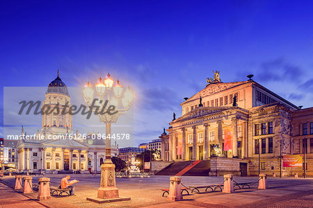 Germany, Berlin, Gendarmenmarkt, Illuminated buildings and street light at dusk