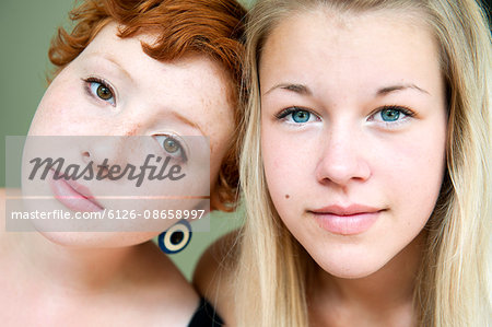 Portrait of redhair young woman and blonde teenage girl (16-17)