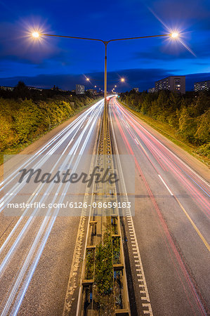 Sweden, Skane, Malmo, Light trails of cars at night