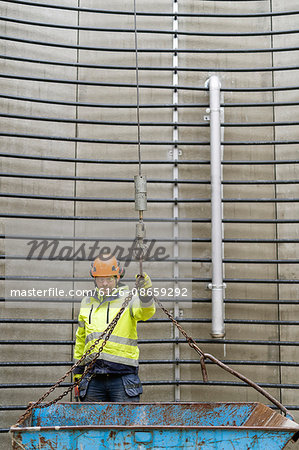 Sweden, Vastmanland, Construction worker standing inside water tower