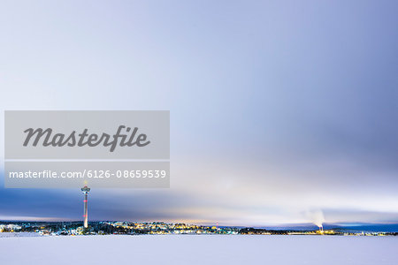 Finland, Pirkanmaa, Tampere, Winter scene with city and communication tower in background