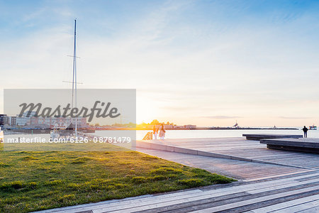 Sweden, Skane, Malmo, Kranplatsen, Promenade at sunset