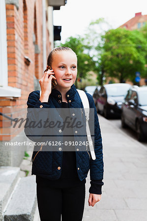 Girl Smiling While Talking On Phone Stock Photo Masterfile Premium Royalty Free Code 6126 09102458 https www masterfile com image en 6126 09102458