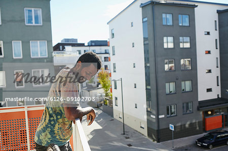 Mid adult man on balcony