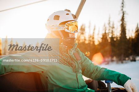 Man wearing goggles and helmet at sunset in Osterdalen, Norway