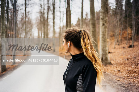 Woman on rural road in Sodermanland, Sweden