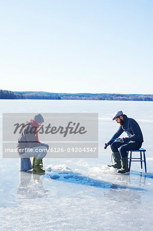 Fishing on a frozen lake in Dalarna, Sweden