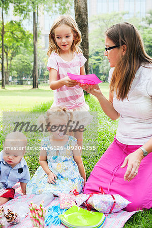 Mother with children at birthday picnic