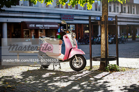 Pink scooter in public square