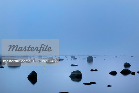 Lange Jan Lighthouse seen through fog in Oland, Sweden