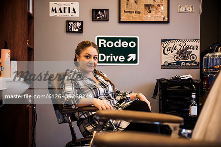 Barber sitting in barber´s chair