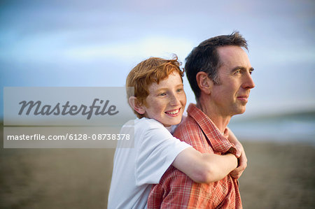 Dad giving son piggyback ride hi-res stock photography and images - Alamy