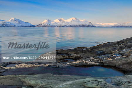 View of Ullstinden that is reflected on the fjord. Lattervik, Ullsfjorden, Lyngen Alps, Troms, Norway, Lapland, Europe.