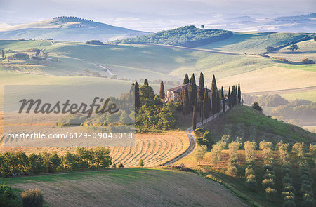 Podere Belvedere, the famous italian farmhouse, during sunrise. Val d'Orcia, Siena province, Tuscany, Italy
