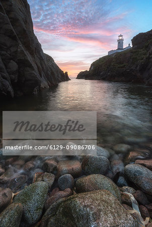 Fanad Head (Fánaid) lighthouse, County Donegal, Ulster region, Ireland, Europe. Pink sunset at Fanad Head Fanad Head (Fánaid) lighthouse, County Donegal, Ulster region, Ireland, Europe. Pink sunset at Fanad Head
