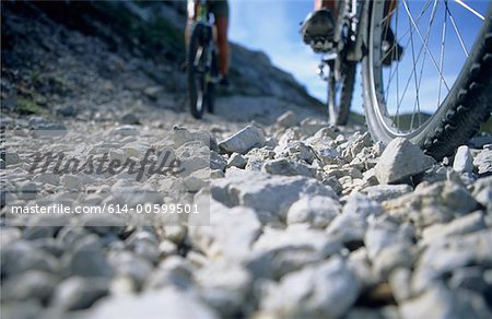 Close up of wheels and people and feet