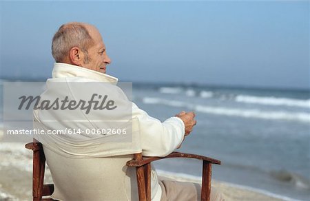 Senior man looking at waves