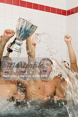 Winning football team in the bath