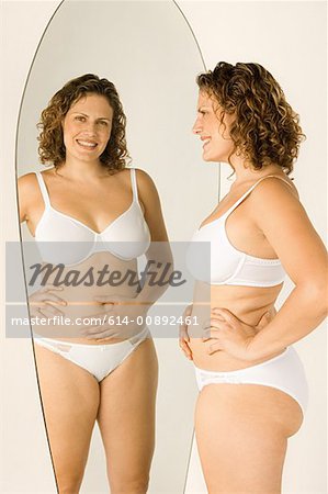 Overweight woman in lingerie in studio - a Royalty Free Stock