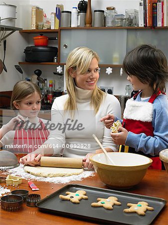 Mother and children making cookies