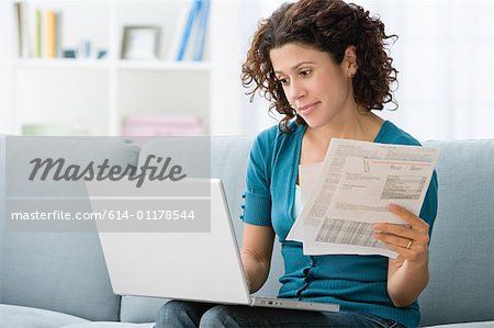 Woman paying bills online