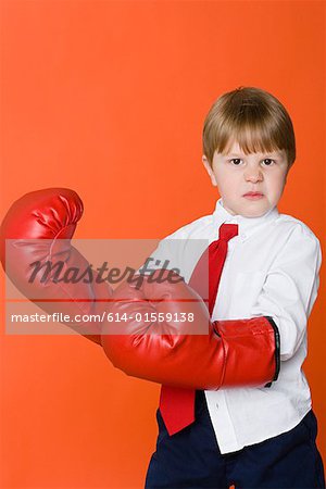 Boy wearing boxing gloves