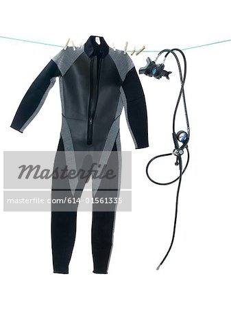 Wet suit and diving equipment on washing line