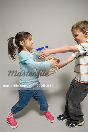 funny baby girl fighting with boy