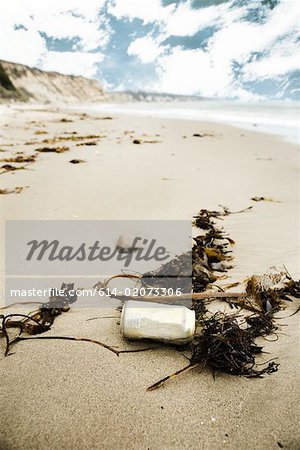 Discarded can on a sandy beach