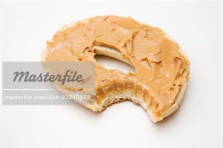 A bagel with a missing bite A bagel with a missing bite