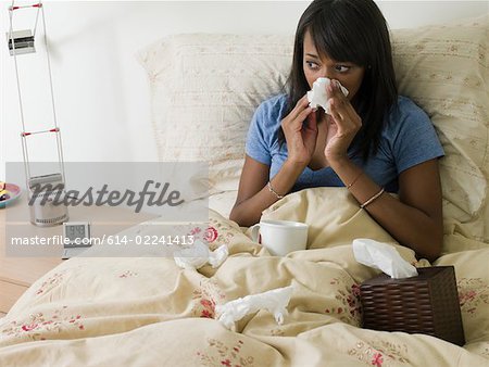 Woman in bed with cold