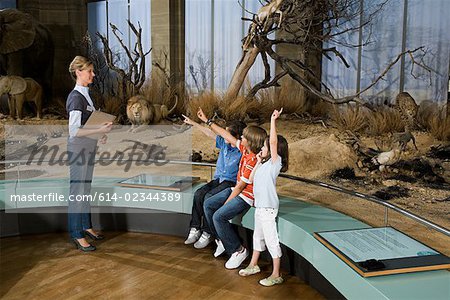 Children and a teacher at a museum