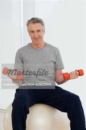 A man lifting dumbbells