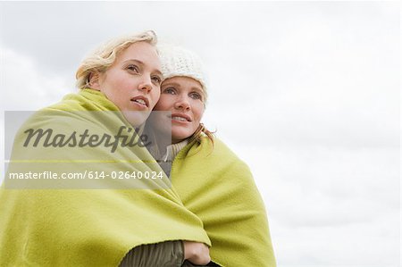 Women sharing a blanket
