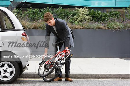 Man with folding bicycle