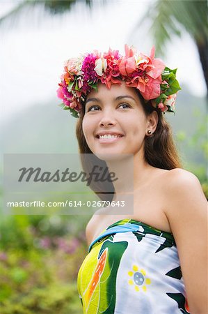 Young woman with flowers in hair in moorea