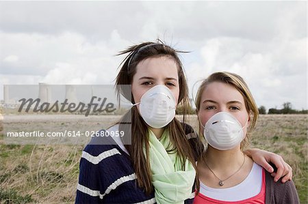 Girls in masks by power station