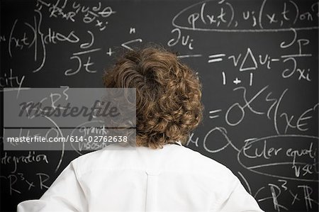 Boy looking at blackboard