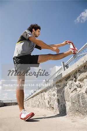 Man stretching his leg