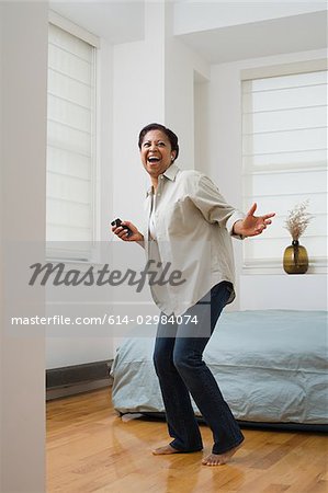 Woman listening to music and dancing