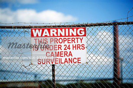 Warning sign on fence