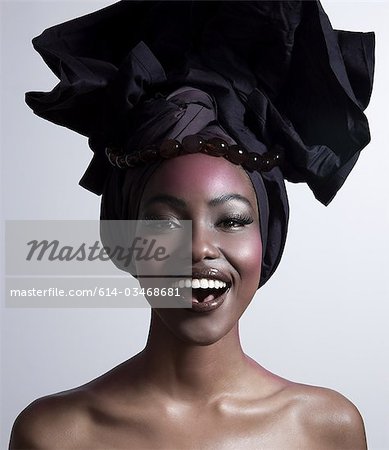 Happy young woman wearing head tie