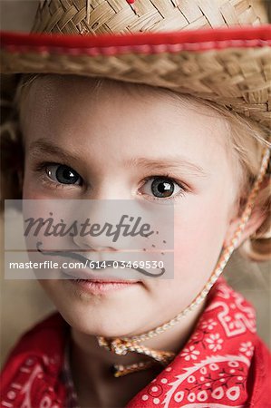 Young girl dressed up as cowgirl